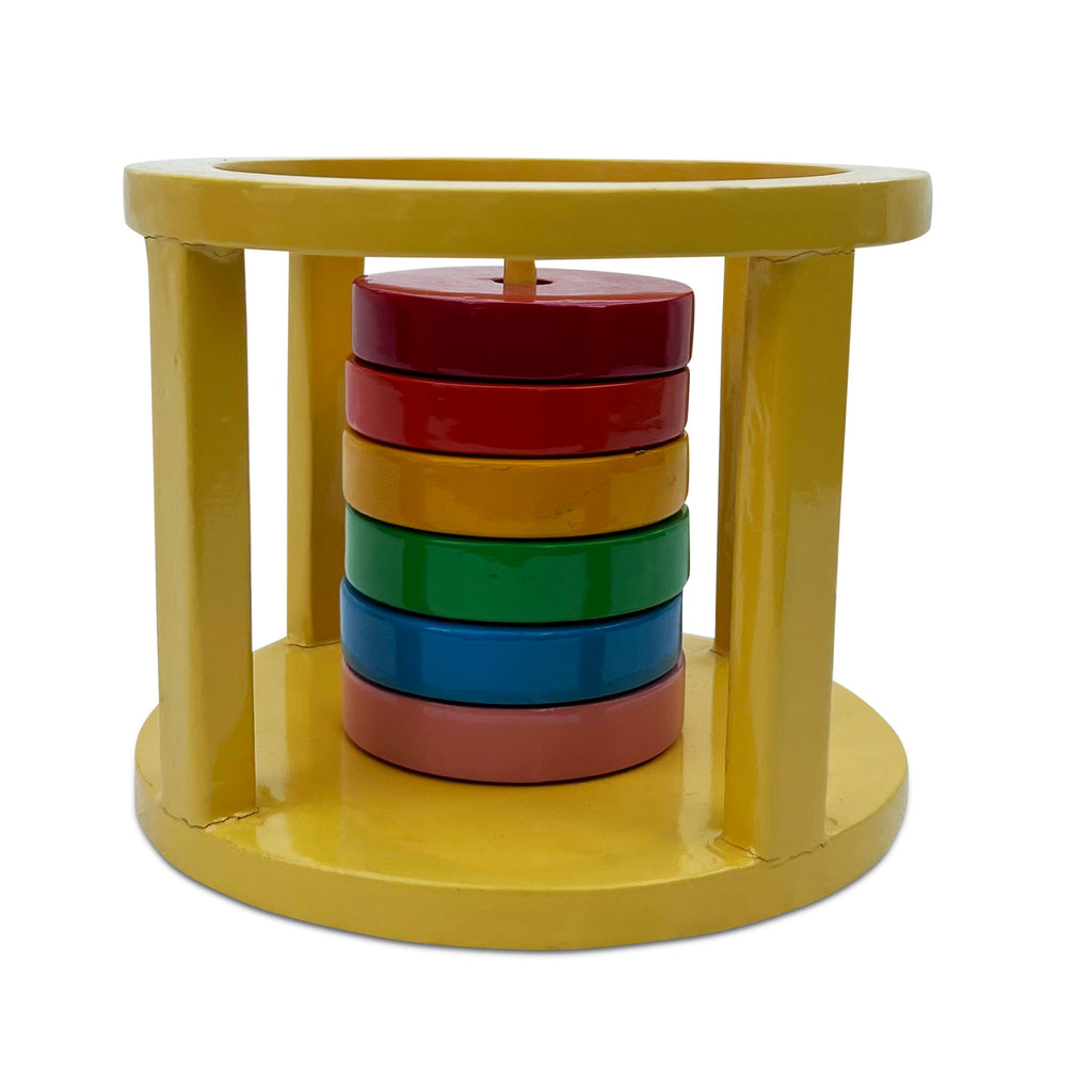 Pyramid Well: coloured discs stacked inside a yellow round frame
