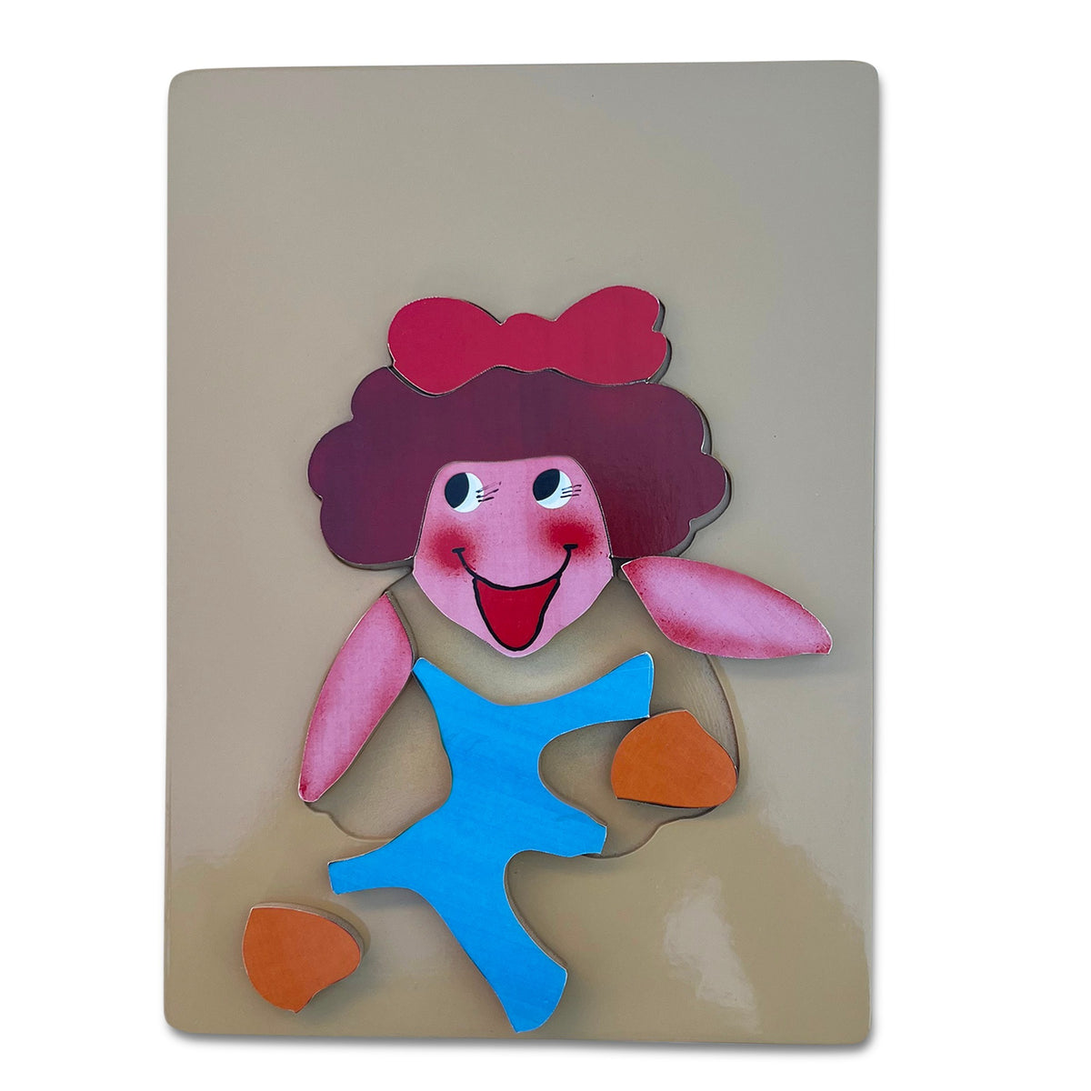 Doll puzzle with pieces lifted out of the tray