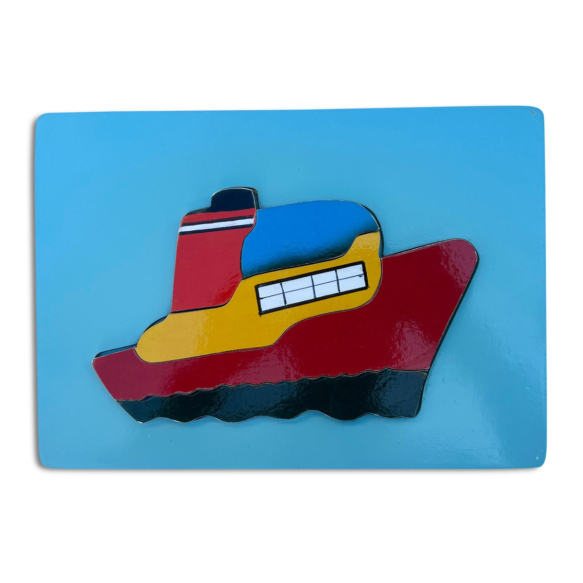 Ship tray puzzle assembled on a blue board