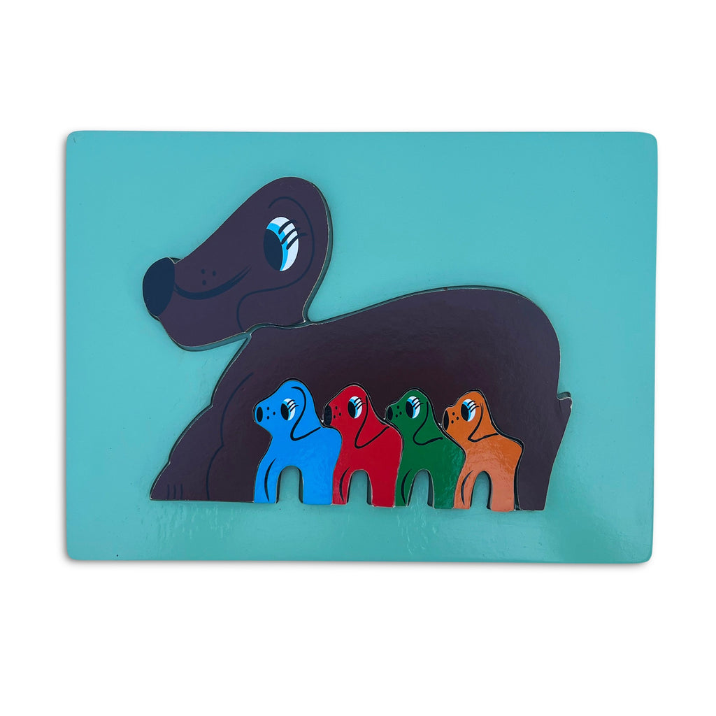 Dog and puppies tray puzzle assembled on a green board
