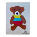 Teddy bear tray puzzle assembled on a white board