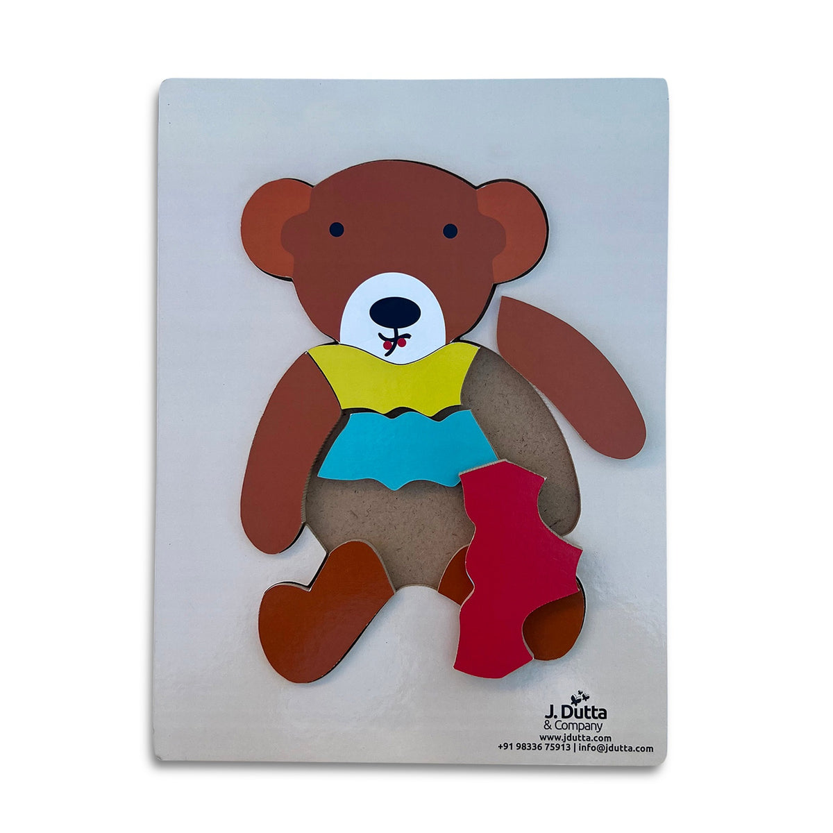 Teddy bear tray puzzle with the arm and shorts pieces lifted out