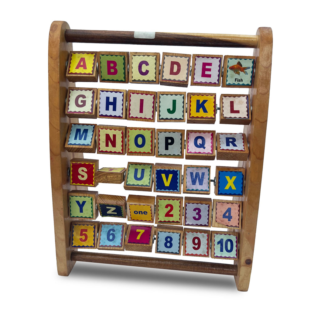 Picture word stand, angled view of the rotating alphabet cubes