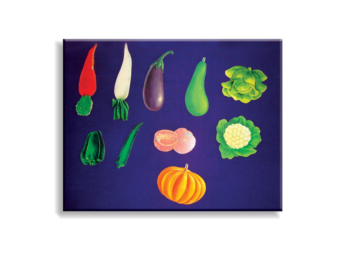 Vegetable cut-outs displayed on a blue board
