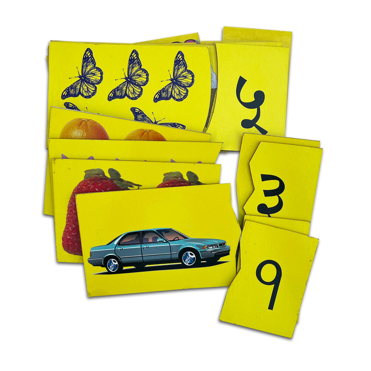 Hindi counting jigsaw tablets: १ with a car, ३ with strawberries, ५ with butterflies