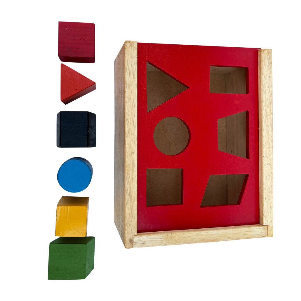 Square posting box with red lid and colourful shape blocks beside it