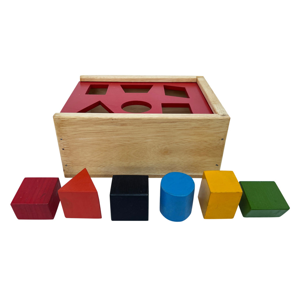 Posting box with shape blocks lined up in front