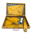 Wooden geometry box open, showing set squares, protractor, compass and ruler