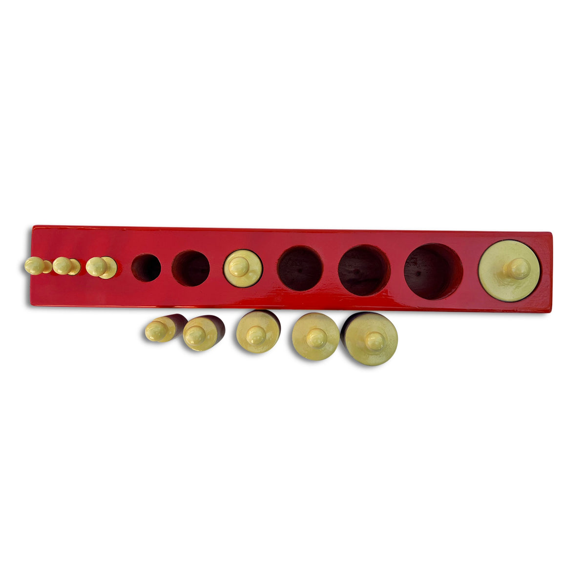 Red cylinder block No. 1 with some knobbed cylinders lifted out