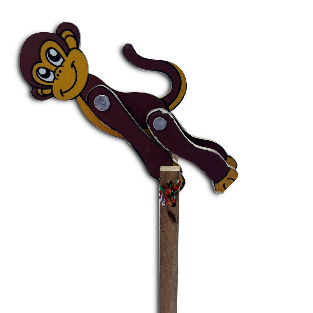 Jumping monkey toy stretched out while flipping