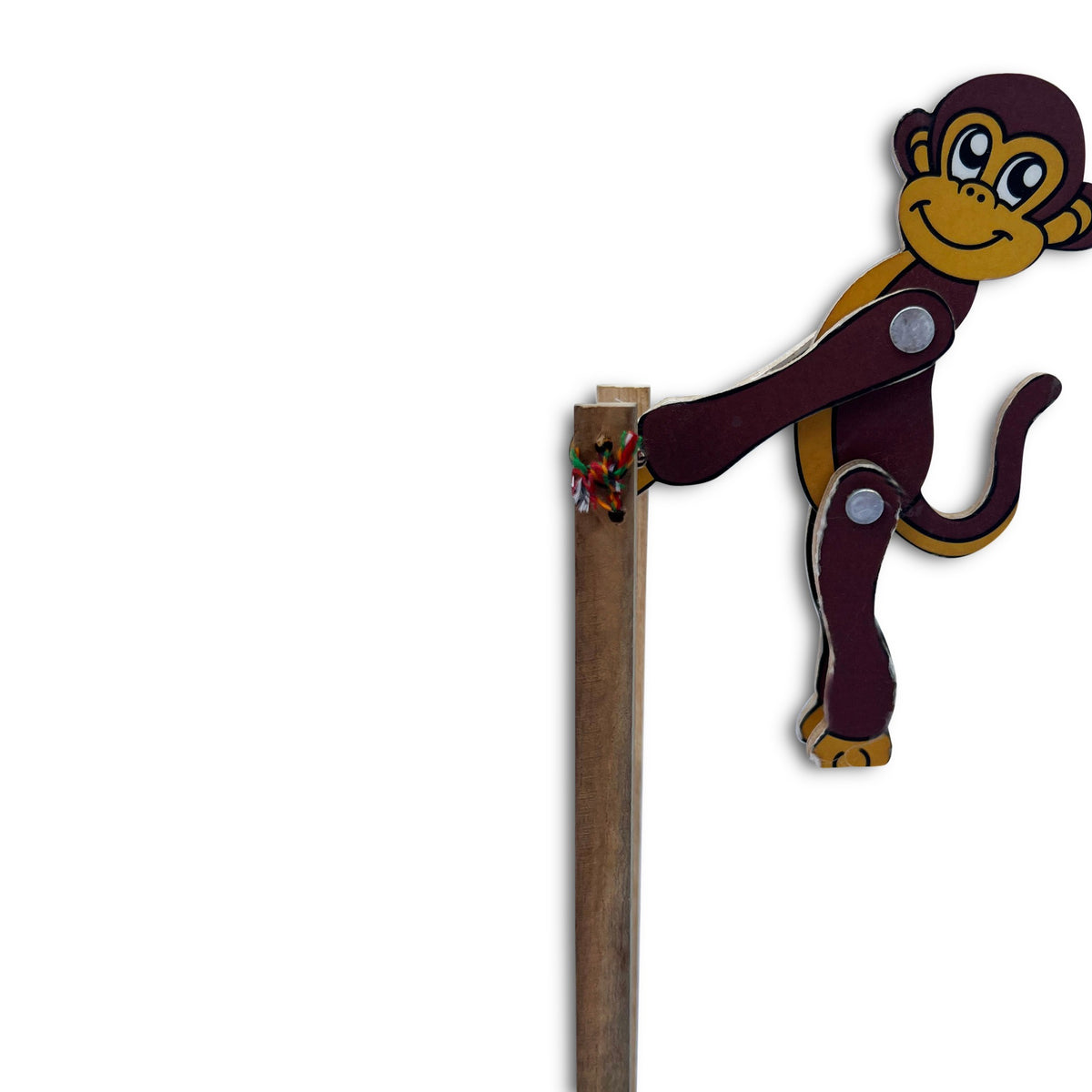 Wooden jumping monkey on its stick, close view