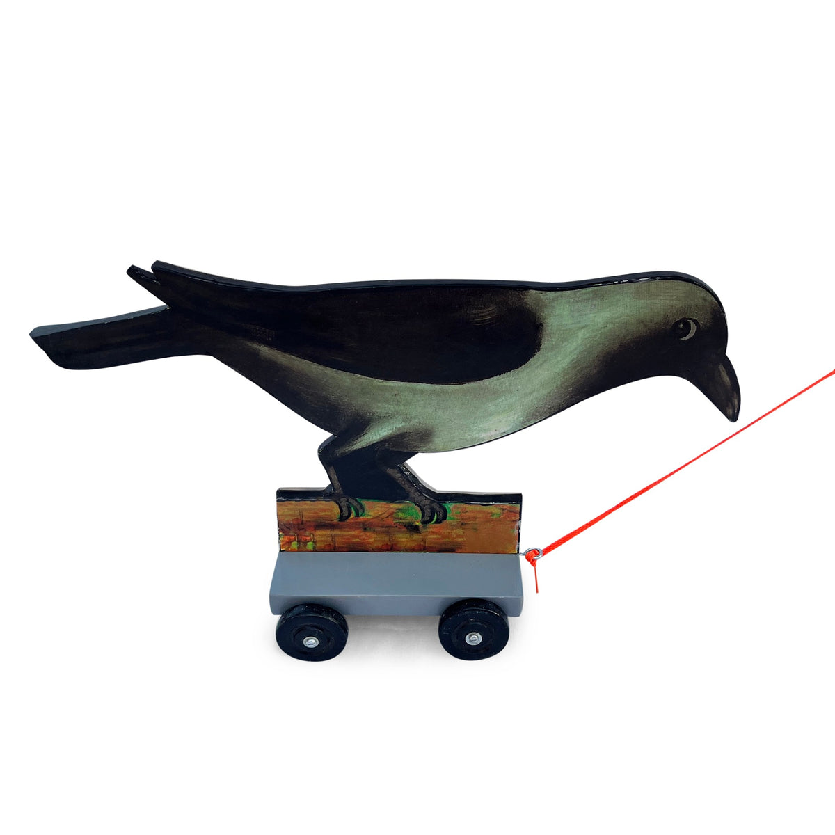 Crow on wheels pull-along toy with red string