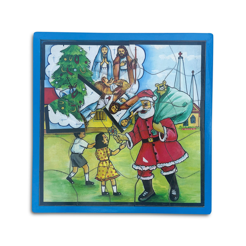Christmas jigsaw puzzle with nativity scene and Santa, pieces in tray