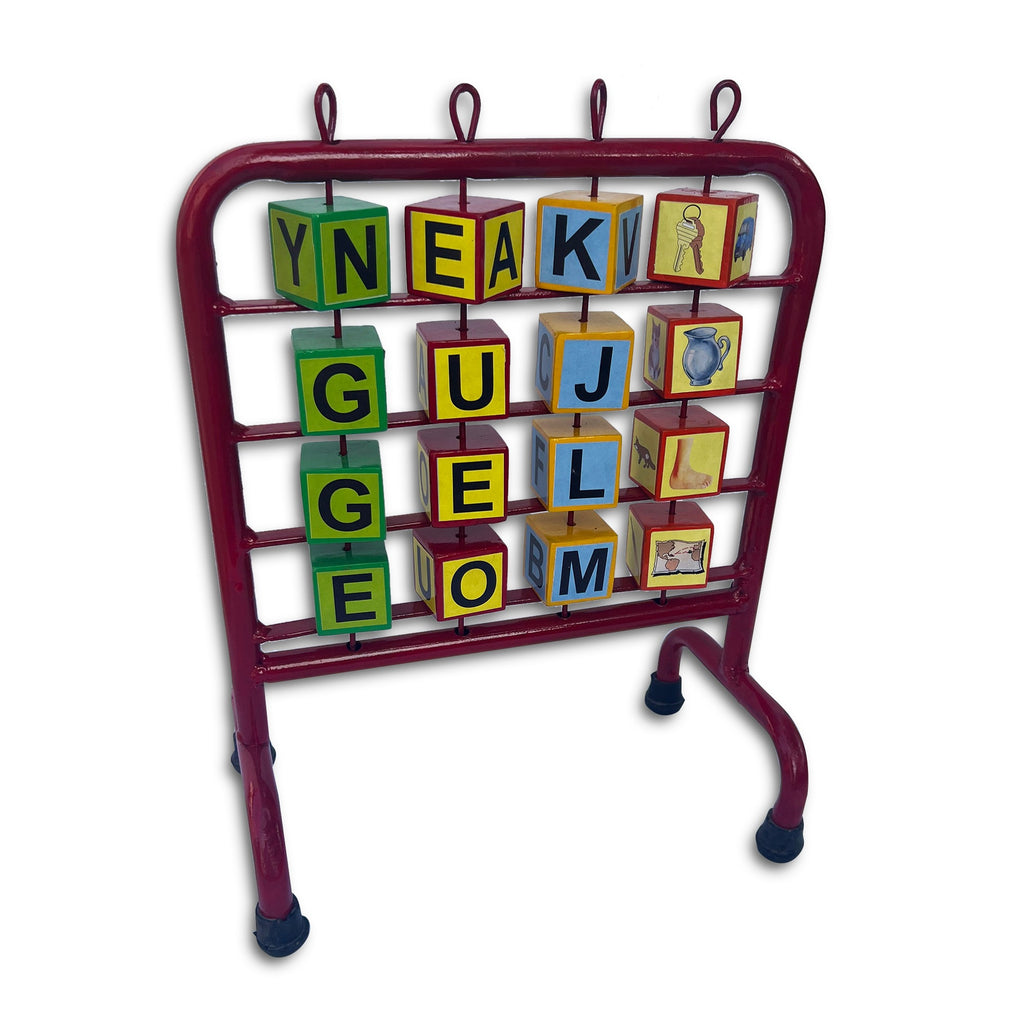 Alphabet stand with cubes spelling words in green and yellow