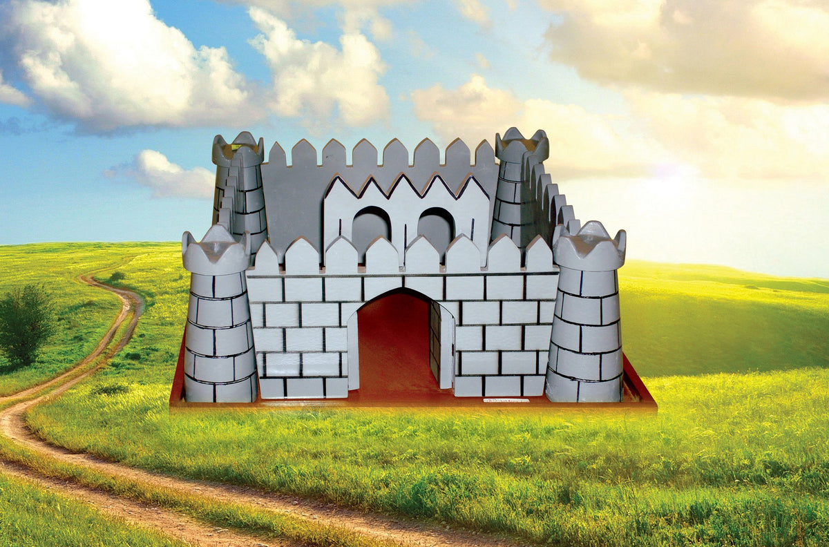 Grey wooden folding fort set up in a green field