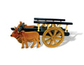 Wooden bullock cart with two brown bullocks and yellow spoked wheels