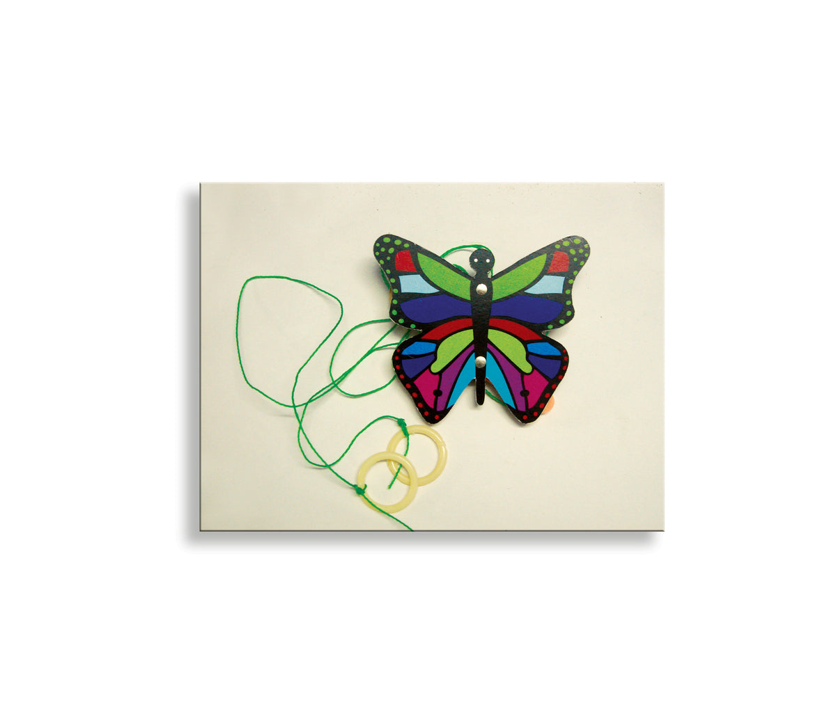 Climbing butterfly toy with green strings and pull rings